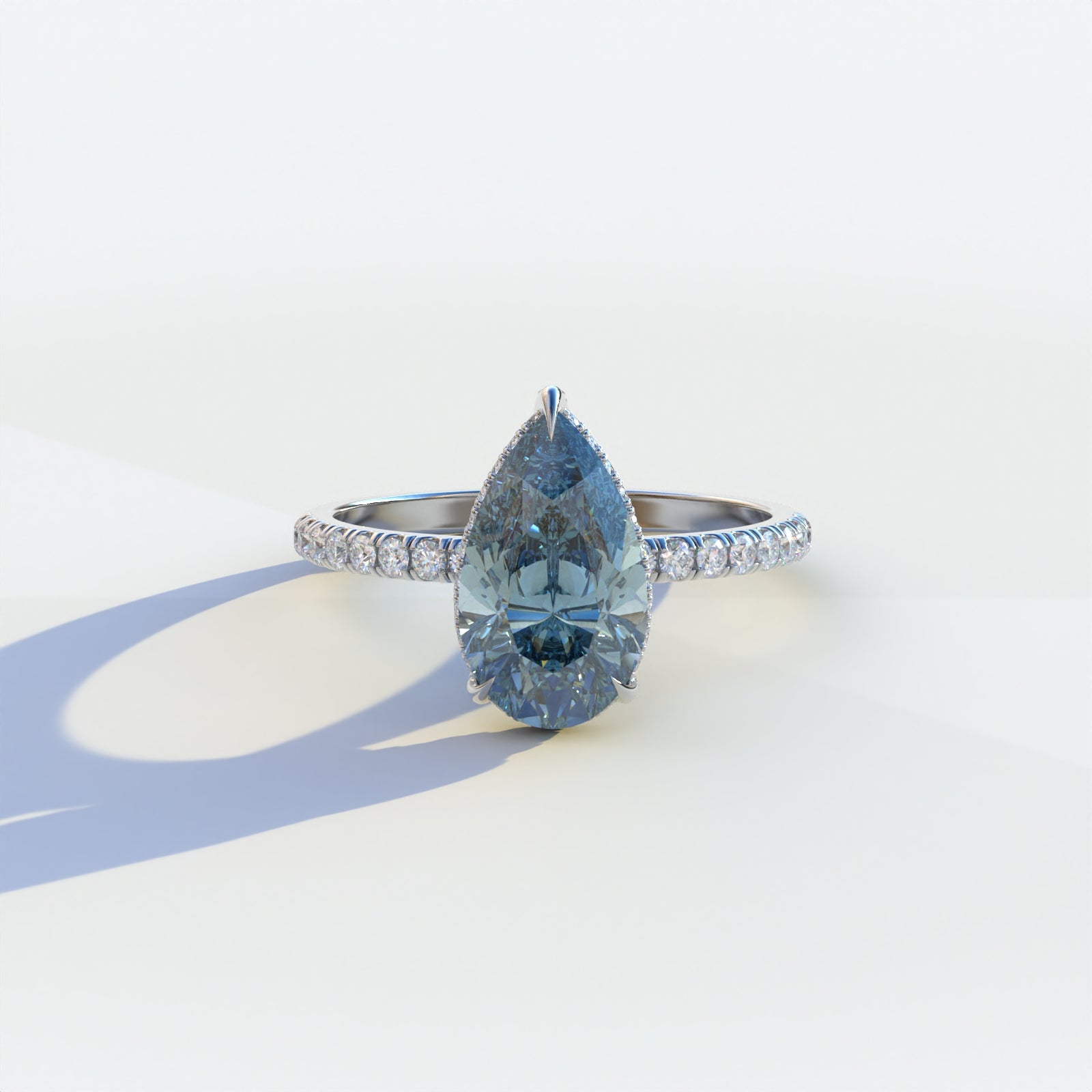 2 carat blue pear cut lab-grown diamond, blue hidden halo pave ring, lab-grown diamond engagement ring, ethical blue diamond ring, pear cut engagement ring